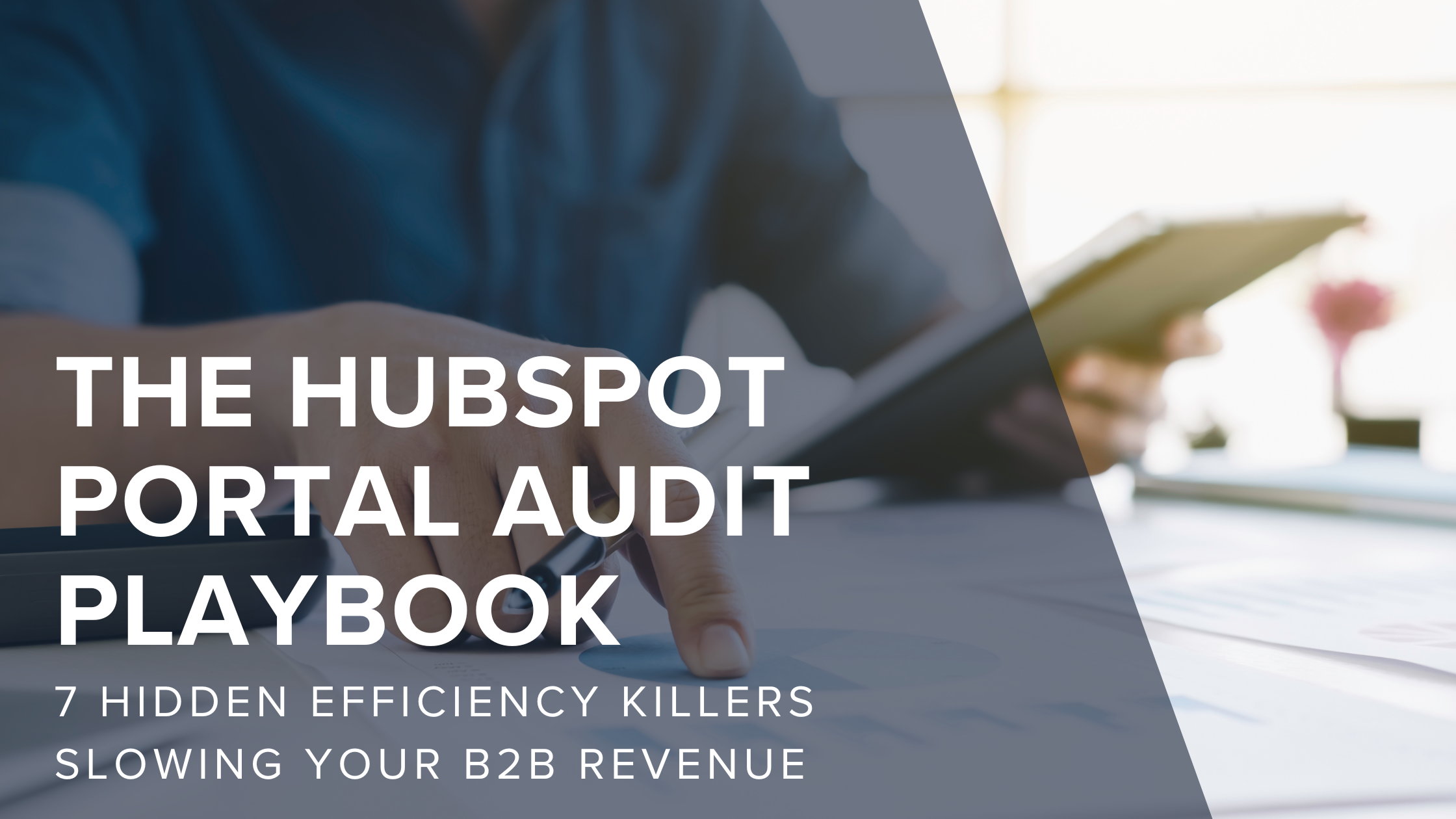 HubSpot portal dashboard on tablet with performance analytics on paper